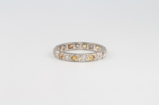 An 18ct white gold diamond and citrine eternity ring size L 2.8G