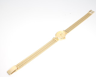 A lady's 9ct yellow gold Accurist wrist watch with mesh bracelet set with a diamond at 12, gross 19.3 grams 