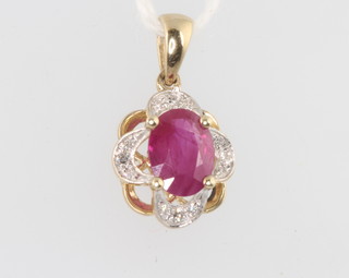 A 9ct yellow gold ruby and diamond pendant 18mm 