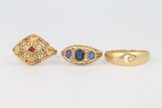 Three 18ct yellow gold rings, 1 set a ruby, 1 set sapphires and diamonds and 1 set a single stone diamond, sizes R, R and P, gross 8.5 grams 