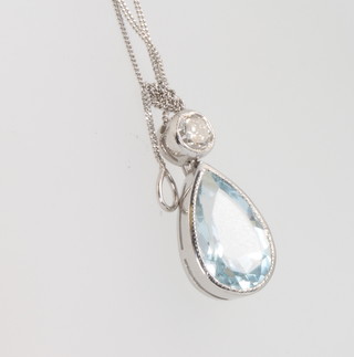 A white gold diamond and aquamarine pendant and chain 18mm 