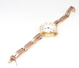 A lady's 9ct yellow gold wristwatch with enamelled dial and red 12 on an expanding 9ct bracelet, gross 23.7 grams 
