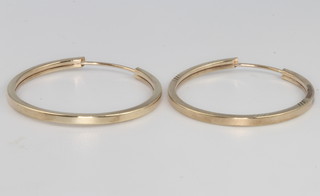 A pair of 9ct yellow gold hoop earrings 1.1 grams