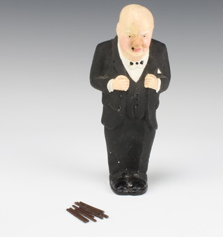 A plaster figure of Sir Winston Churchill with 8 lighttable cigars 22cm 