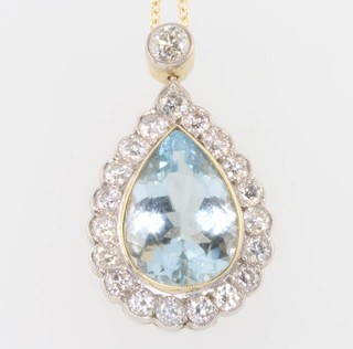 An 18ct yellow gold pear cut aquamarine and diamond pendant and chain 1.7ct, 25mm 