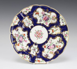 A 19th Century Worcester lobed bowl, the blue ground with panels of spring flowers 25cm 