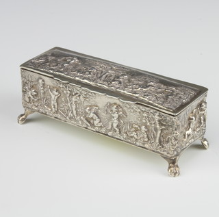 An Edwardian repousse silver rectangular trinket box decorated with cavorting cherubs raised on paw feet Birmingham 1902, 13cm, 125 grams 