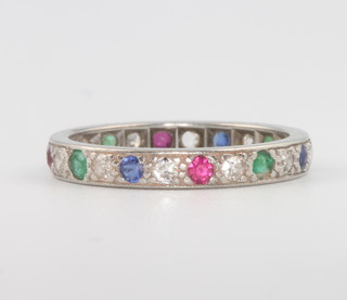 A platinum, diamond and gem set eternity ring 3.9 grams, size L 1/2