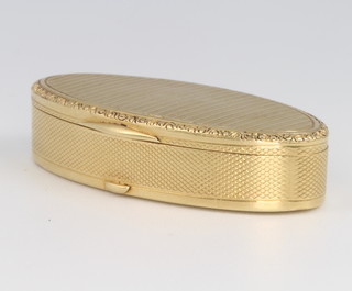 An 18ct yellow gold oval engine turned pill box, the base inscribed "To Libby with all my love and sincerity in remembrance of the unhappiest days of my life August September October 1943 Tom" 39mm 10.5grams 