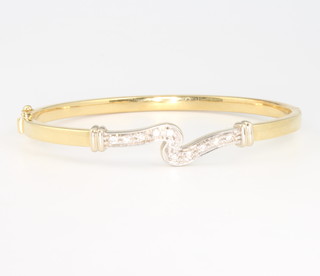 An 18ct yellow gold diamond bangle 13.1 grams 