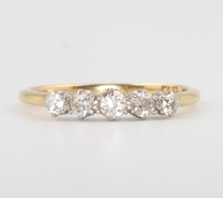 An 18ct yellow gold 5 stone diamond ring size N 2.3 grams 