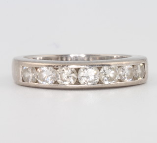 An 18ct white gold 7 stone diamond ring 4 grams, size H 1/2