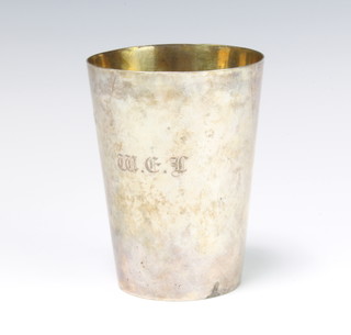 An Indian silver beaker of plain form with engraved monogram and crest, the base marked Cooke and Melvey Calcutta 11.5cm, 275 grams 