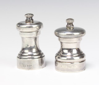 A silver pepper grinder London 1965 8cm, ditto 7cm 