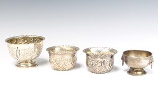 An Edwardian repousse silver pedestal bowl decorated with flowers London 1902, 3 similar bowls 354 grams