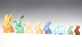 A Sylvac green glazed bunny 1303 17cm, a beige ditto 1302 14cm and 5 other bunnies 