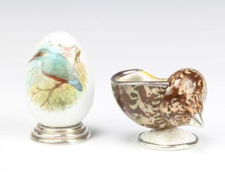 An enamelled egg decorated with birds on a silver base 7cm and a silver mounted shell 6cm 