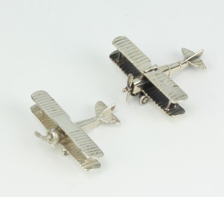 Two 925 standard silver models of a bi-plane, one with swivelling propellor 32 grams 
