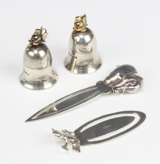 Two silver tooth fairy boxes in the form of bells and 2 modern book marks