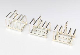 A pair of silver 5 bar toast racks Sheffield 1921 and a similar London 1984, 270 grams