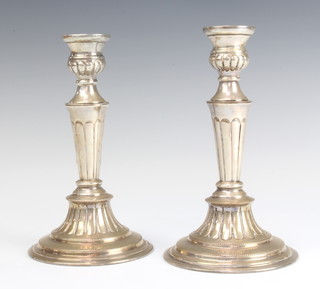 A pair of silver plated tapered candlesticks 20cm 
