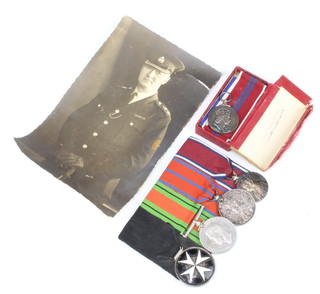 A Second World War medal group to GV Frankton comprising Serving Brother of the Most Venerable Order of St John of Jerusalem, Defence medal, George V Coronation medal, George V Jubilee medal together with Queen Elizabeth II Coronation medal with original posting box together with a photograph of the recipient 