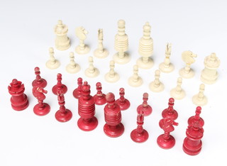 A 19th Century carved, turned and stained ivory chess set, the King 10cm 