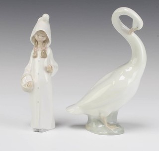 A Lladro figure of a girl holding a basket 22cm and a Continental figure of a goose 22cm 