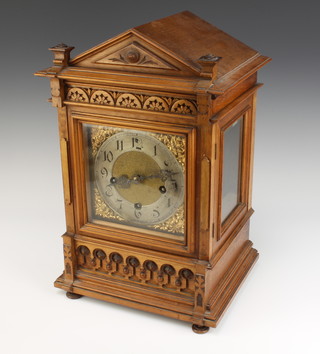 An Edwardian Continental 8 day striking bracket clock with gilt dial, silvered chapter ring and Arabic numerals contained in a carved walnut case, striking on 2 gongs, the back plate marked PS28132 (no pendulum or key)  