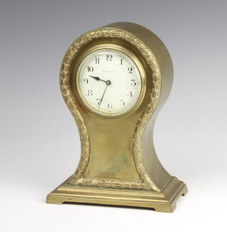 An Edwardian Continental timepiece with silvered dial and Arabic numerals contained in a silver plated case marked Elkingtons (plate rubbed) 