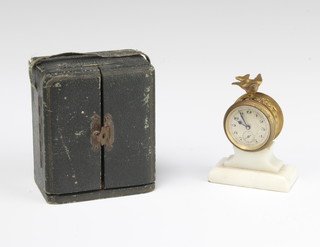 A 19th Century French miniature timepiece with silvered dial, subsidiary second hand and Arabic numerals contained in a gilt metal case surmounted by a figure of a bird and raised on a shaped marble base 7cm x 2.5cm x 5.5cm, contained in a fitted leather case 