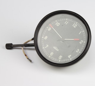 A Jaeger car clock, the 9cm black dial with Roman numerals marked O.1.11. Jaeger 