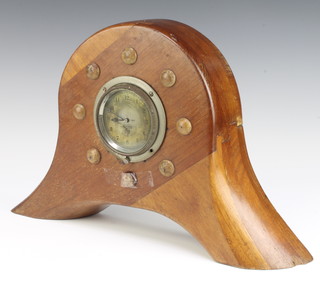 A Smiths 8 day car clock with silvered dial and Arabic numerals marked AH-2880 contained in a mahogany propellor boss marked P2680 