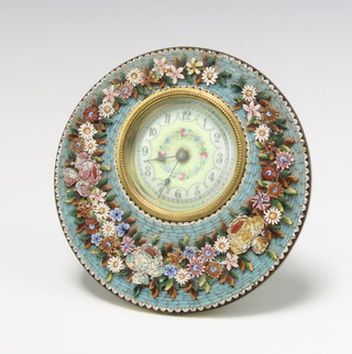 A 19th Century Continental timepiece with porcelain dial and Arabic numerals contained in a circular micro mosaic floral patterned case 12cm diam. 