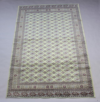 A green ground Belgian cotton Bokhara style carpet with numerous octagons to the centre 300cm x 200cm (no fringe) 
