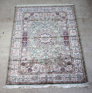 A green ground Belgian cotton Kashan style carpet with central medallion 230cm x 160cm 