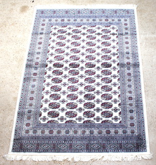 A white and red ground Belgian cotton Bokhara style carpet 200cm x 140cm 