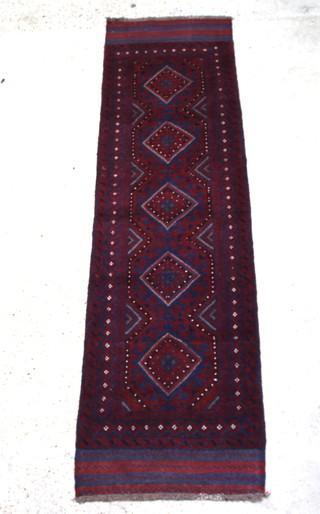 A red and  blue ground Mashwani runner with 5 diamonds to the centre within a multi row border 251cm x 68cm 