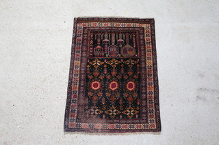 A brown and black ground Belouche rug within a multi-row border 121cm x 83cm 