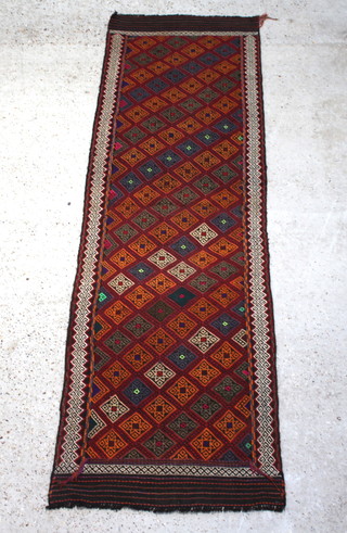 A tan, green and brown ground Suzni Kilim runner with overall geometric design 240cm x 76cm 