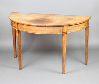 A Georgian mahogany demi-lune table raised on square tapered supports 73cm h x 123cm w x 60cm d 