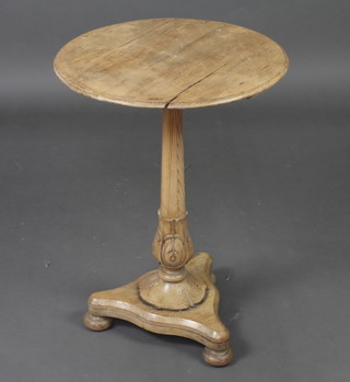 A William IV carved and bleached mahogany wine table on a chamfered column with triform base, bun feet 70cm h x 49cm 