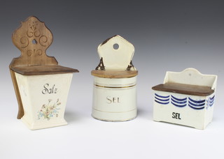 A Continental salt box with wall mount and hinged lid, a tin ditto and a ceramic salt container with hinged lid 