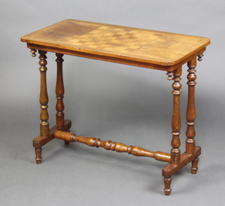 An Edwardian rectangular inlaid mahogany stretcher table, the top inlaid a chess set, raised on turned supports with H framed stretcher 69cm h x 83cm w x 41cm d 