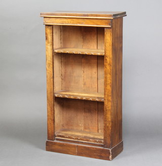 A Victorian walnut bookcase fitted adjustable shelves raised on a platform base 106cm h x 56cm w x 27cm d 