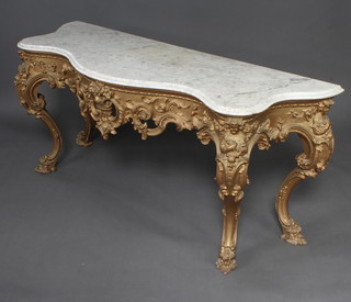 A 19th Century carved and gilt painted wood console table of serpentine outline raised on cabriole supports 78cm h x 176cm w x 62cm d 