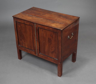 A rectangular Georgian mahogany cabinet enclosed by panelled doors with brass swan neck handles to the side, 56cm h x 62cm w x 37cm d 