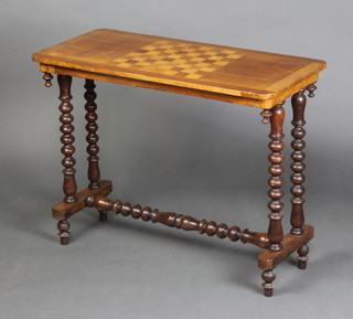 A Victorian oval inlaid mahogany stretcher table, the top inlaid a chessboard raised on bobbin turned supports with stretcher 68cm h x 87cm w x 41cm d