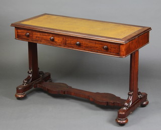 A Victorian mahogany writing table with inset leather writing surface, fitted 2 frieze drawers and raised on standard end supports with shaped stretcher, raised on bun feet 75cm x 113cm x 54cm 