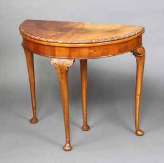 A 1930's Queen Anne style mahogany card table with gadrooned border raised on club supports 73cm x 80cm x 41cm  